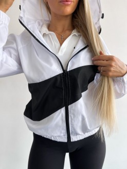 Жіноча куртка-вітрівка з капюшоном колір білий р.42/46 454224